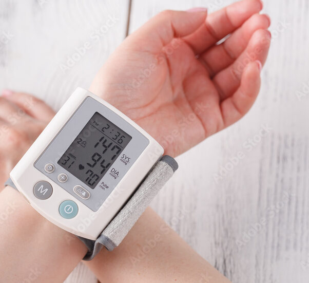 Wrist blood pressure monitor displaying a reading