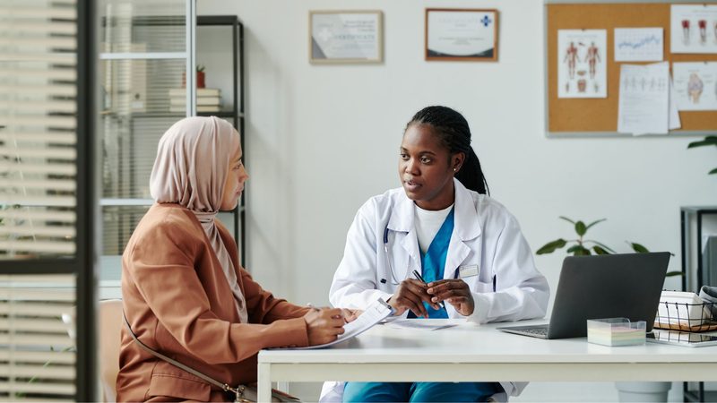 Hospital committee reviewing an evidence dossier for a new medical device
