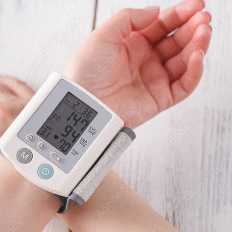 Wrist blood pressure monitor displaying a reading